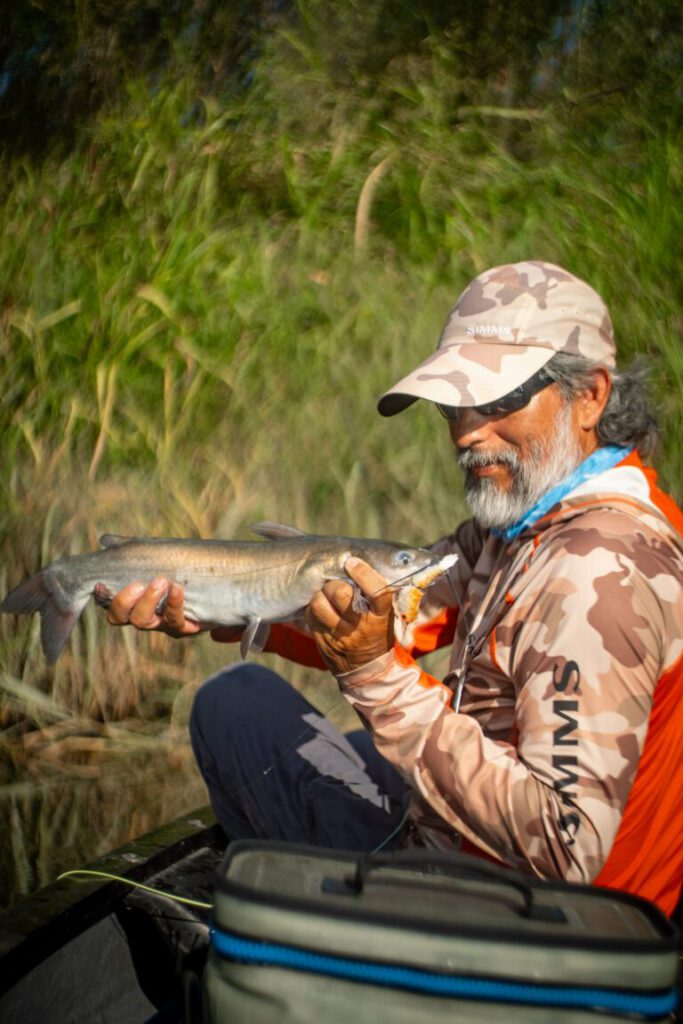 Marcus With Catfish 768x1152 — Broken Minnow hand-tied fly